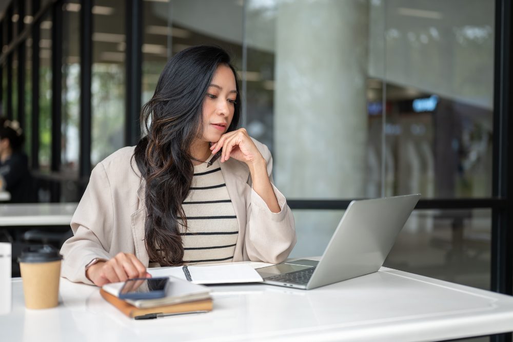brokerage-matter-woman-debating-laptop